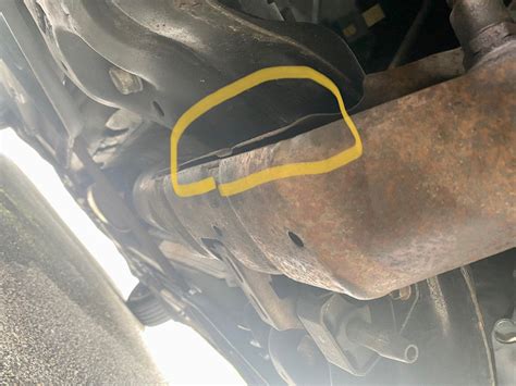 metal sheet above exhaust loose|metal plate under exhaust.